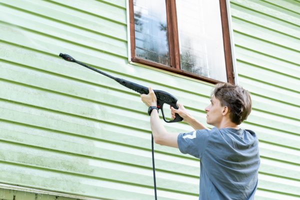 a-young-man-washes-the-facade-of-a-country-house-w-2025-03-08-21-38-31-utc (2)